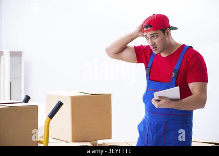 Contractor worker moving boxes during office move Stock Photo