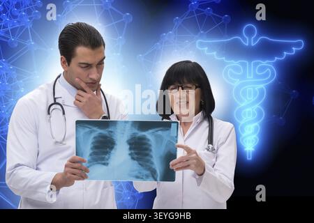 Two doctors discussing x-ray image in telemedicine concept Stock Photo