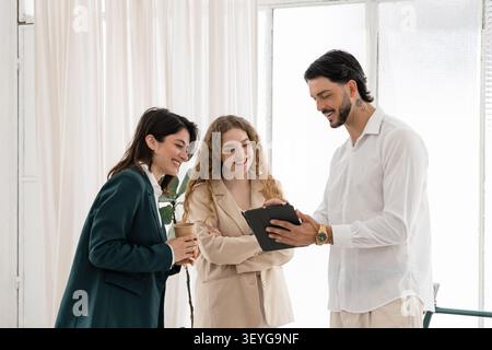Business colleagues discussing data on digital tablet Stock Photo