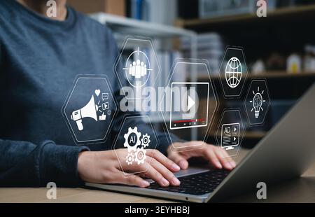 Video marketing and digital content creation strategy concept. content creator using laptop to optimize online advertising, AI automation tools, Stock Photo