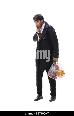 Young handsome man with vegatables in shopping concept Stock Photo