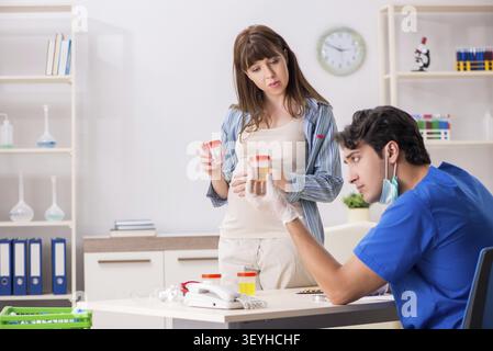 Pregnant woman visiting doctor for check-up Stock Photo