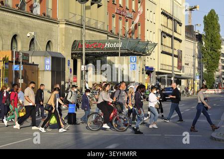 Pedestrians crossing the street at green traffic lights, Munich, Bavaria, Germany Stock Photo