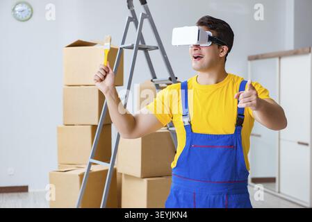 Painter contractor working with virtual reality goggles Stock Photo