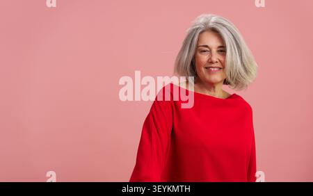 Mature woman smiling, embracing positive healthy longevity concepts Stock Photo