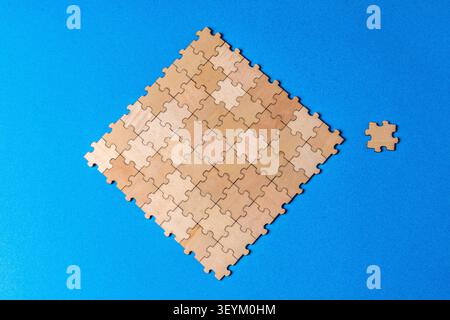 Puzzle pieces forming a cohesive unit with missing element Stock Photo