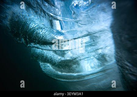 Inside a powerful ocean wave showing light and water textures Stock Photo