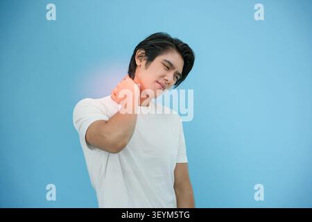 office syndromes, man massaging neck pain due to work and using a computer, digital composite of a focused spine of neck pain and shoulder pain sympto Stock Photo