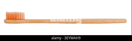 Eco-friendly bamboo toothbrush with orange bristles isolated on white background. Stock Photo