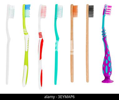 Row of various plastic and bamboo toothbrushes isolated on white background. Stock Photo