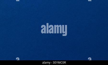 Dark blue textured paper background with subtle grain for clean design Stock Photo
