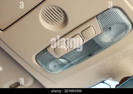 Car interior ceiling light and speaker panel Stock Photo