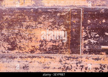 painted rusty surface of welded pipe of large pipeline in idle old Demidov metallurgical plant in Nizhny Tagil city Stock Photo