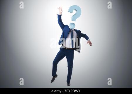 Businessman with question mark instead of head Stock Photo