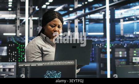 Computer scientist uses node tree AI software to analyze infrastructure and identify issues in a data center. Stock Photo
