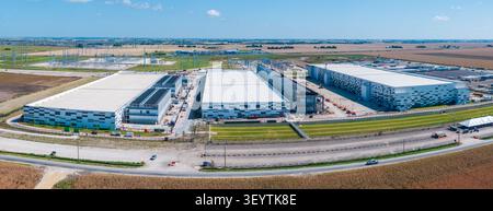 Hutto, Texas - July 4, 2026: Aerial view of a large data center campus with three massive buildings with 400M sq ft of space and 600MW power capacity Stock Photo