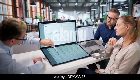Diverse Business Team Collaborates Using Cloud-based ERP Software. Stock Photo