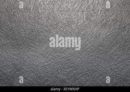 Grey abstract textured surface showing woven or scratched metallic fibers Stock Photo