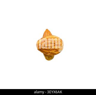 Almond nuts in stacks are isolated on white background with clipping path. Stock Photo