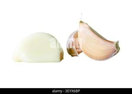 Side view set of unpeeled garlic cloves in small pile is isolated on white background with clipping path. Stock Photo