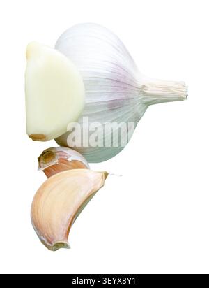 Garlic bulb with cloves in heap is isolated on white background with clipping path. Stock Photo