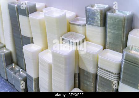 Pile of disposable plastic containers for take away food. plastic boxes for food packaging Stock Photo