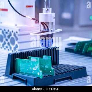 automtic flexible robotic arm system in intellegence pcb factory Stock Photo