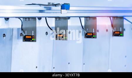 transducer on industrial machine robot in assembly line working in factory. Smart factory industry 4.0 concept. Stock Photo