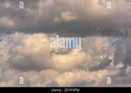 Dramatic storm clouds with patches of blue sky, nature background. Abruzzo, Italy, Europe Stock Photo