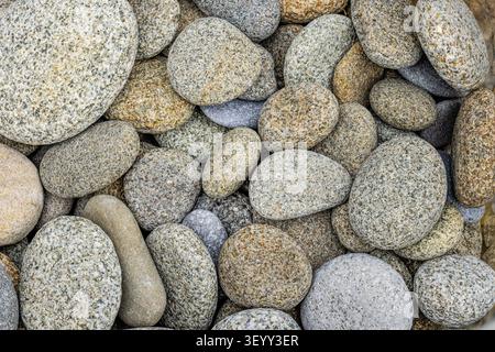 Weathered pebbles on a beach, South Wales Stock Photo
