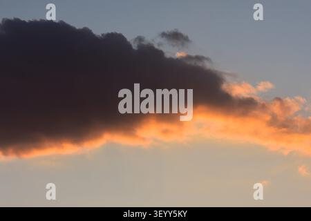 Sunset clouds over the lake Stock Photo
