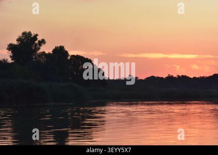 Sunset clouds over the lake Stock Photo