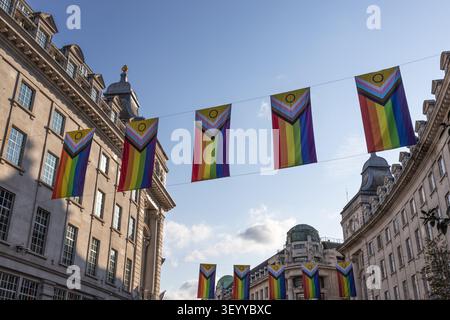 Progress pride flags hanging on Regent Street in London Stock Photo
