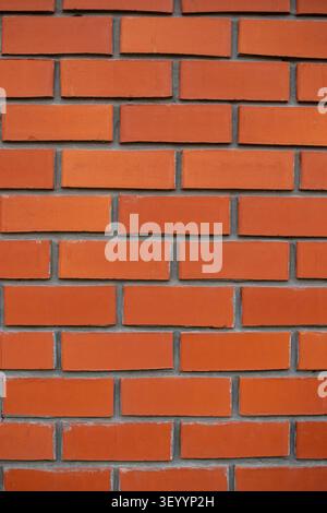 Clean new red brick wall vertical texture backdrop Stock Photo