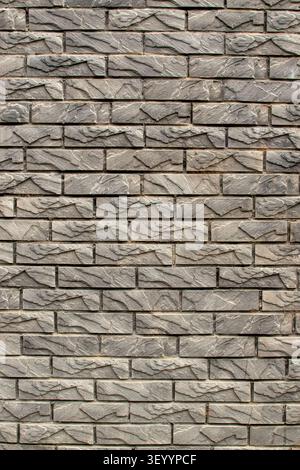 Grey artificial stone cladding wall vertical texture Stock Photo