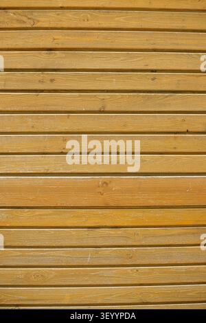 Yellowish wooden planks siding wall texture Stock Photo