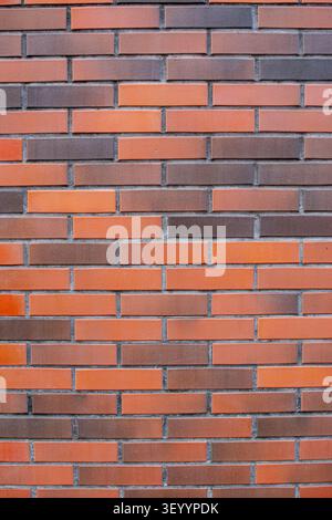 Modern smooth red and brown clinker brick wall vertical texture Stock Photo