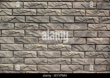 Grey decorative stacked stone wall horizontal texture Stock Photo