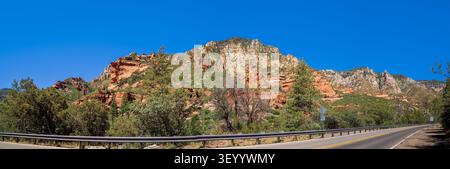 A striated red sandstone formation on Rte 89A from Sedona to Flagstaff, Arizona Stock Photo