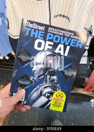 CHICAGO, IL, USA - JANUARY 20, 2026: A person holds 'TheStreet: The Power of AI' magazine against a backdrop of a Cowboys jersey. TheStreet is a leadi Stock Photo