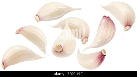 Falling garlic cloves isolated on white background Stock Photo