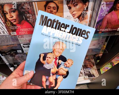 CHICAGO, IL, USA - JULY 15, 2021: A person holds a copy of Mother Jones magazine, featuring a cover illustration of Donald Trump with cartoon-like rep Stock Photo