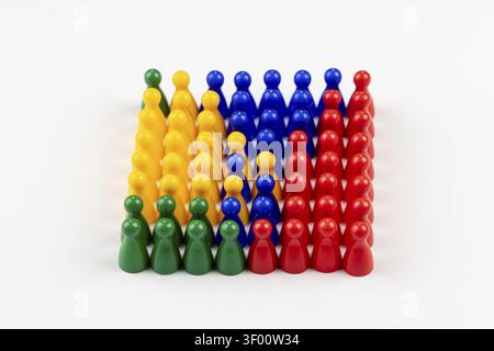 Colourful game figures arranged in neat rows on a white background Stock Photo