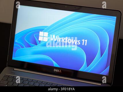 CHICAGO, IL, USA - JULY 15, 2021: A Dell laptop is seen displaying the Windows 11 startup screen. The laptop screen shows the new Windows 11 logo agai Stock Photo