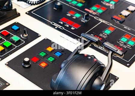 Close up view of marine vessel engine control panel console with throttle levers buttons and alarm status indicators Stock Photo