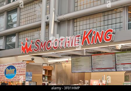 CHICAGO, IL, USA - MARCH 03, 2021: Bright red and white Smoothie King signage is displayed prominently inside a modern establishment. The kiosk featur Stock Photo