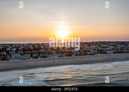 Aerial View of the Sun Setting over the Pamlico Sound and Atlantic Ocean in Avon North Carolina Stock Photo