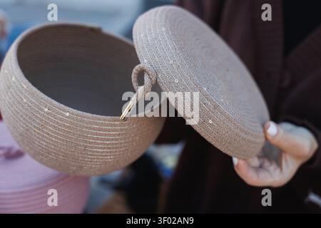 Close view of round woven storage box with lifted Stock Photo