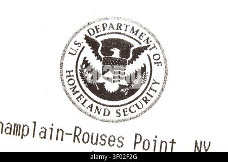 DALLAS, TX, USA - FEBRUARY 16, 2024: Close-up image of the U.S. Department of Homeland Security's official seal printed on a document. The seal featur Stock Photo