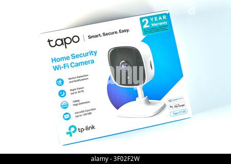 DALLAS, TX, USA - FEBRUARY 16, 2024: A TP-Link Tapo home security Wi-Fi camera is showcased in its retail packaging. The box prominently displays feat Stock Photo
